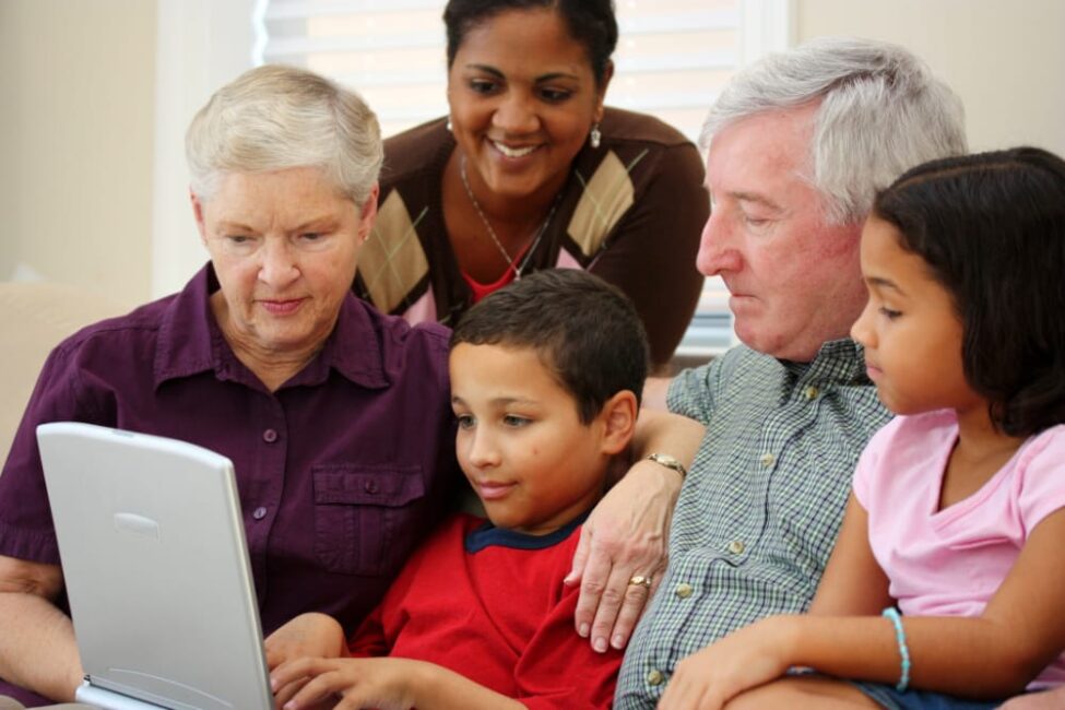 family looking at a computer